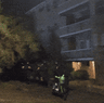 The line of police move in to make the arrest.