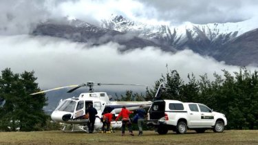 Helicopters on the ground in Wanaka waiting for the weather to clear.