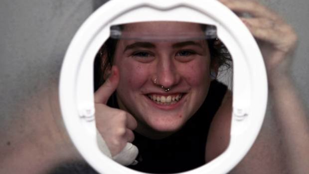 Caitlin Mays has learnt the hard way not to climb through a cat door. 