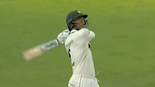Razaullah Khan smashes one for six.