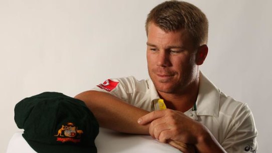 David Warner poners the baggy green cap ahead of his Test debut in 2011.