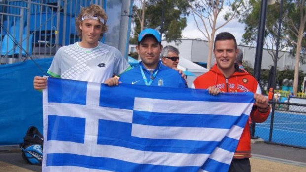 Tsitsipas (L) with two of his Greek fans at an Australian Open juniors tournament. 
