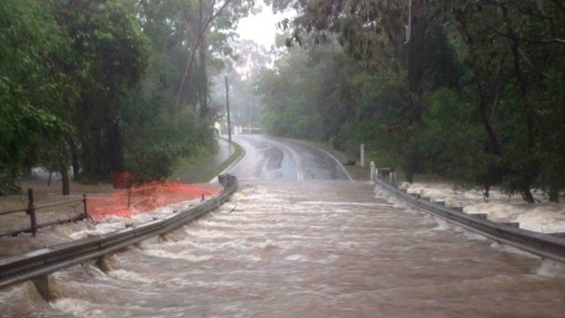 Rainfall over in Queensland has flooded roadway.
