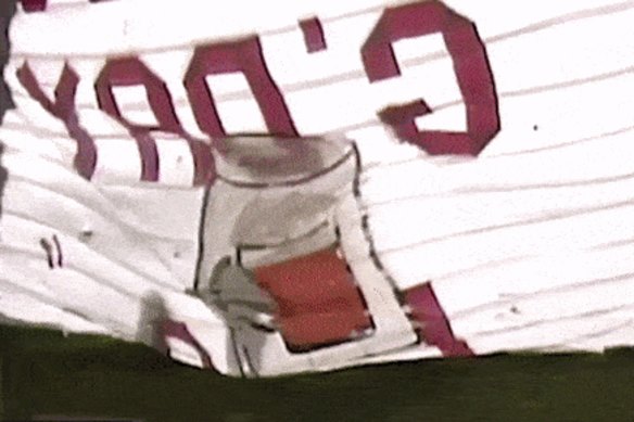 NSW captain Peter Sterling struggles to burst through a banner at the start of the 1987 Origin game in California.