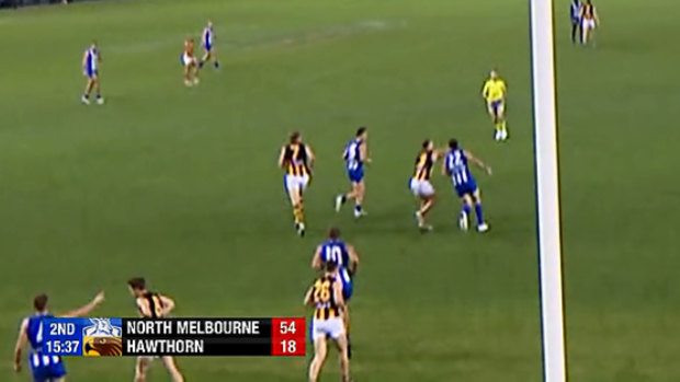 Screen grab of footage showing Hawthorn star Tom Mitchell clips Todd Goldstein behind the play.