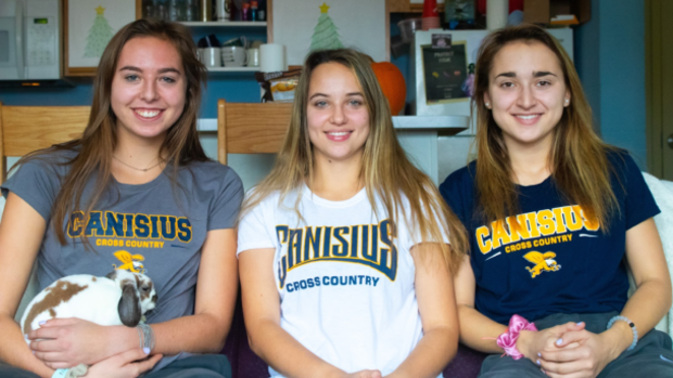 Emily Scheck (centre), alongside Grace Hausladen (left) and Justyna Wilkinson.