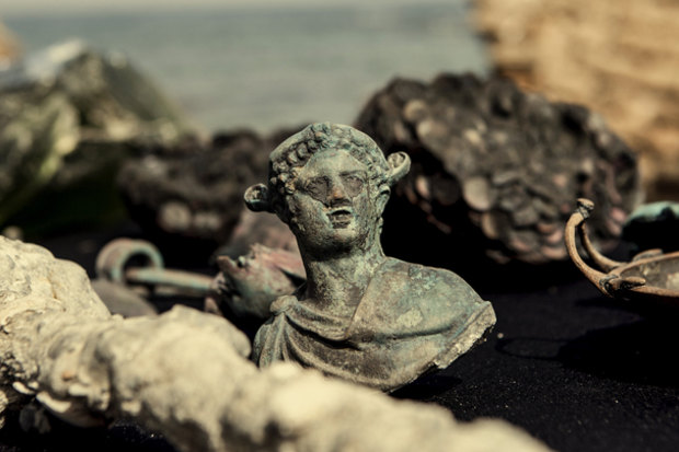 Bronze artefacts from a cargo ship that sank 1600 years ago on show in Caesarea, Israel in 2016.