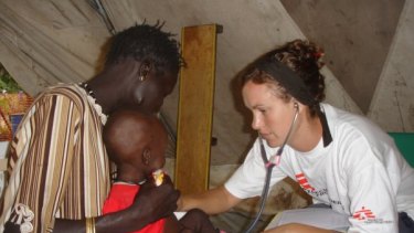 Kent nursing a child in 2007 at the Therapeutic Feeding Centre in Leer, a town in what is now known as South Sudan.