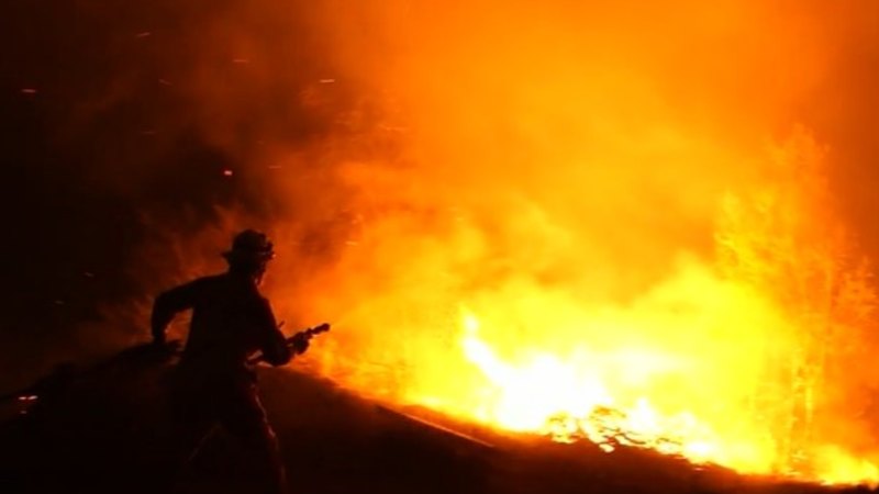 Man accused of stealing two fire trucks as Qld burns