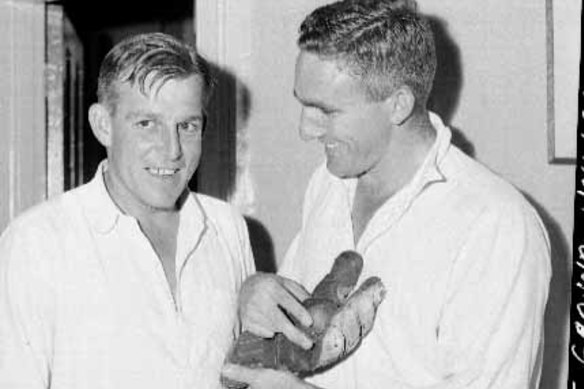 Team man:  Alan Davidson, right,  share a laugh with keeper Wally Grout in the SCG change rooms in 1961.