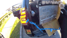 A Brisbane man has been fined more than $1000 after he was found laying down next to a fridge inside a moving car.