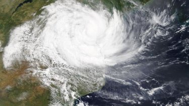 An image of Cyclone Idai from NASA’s Terra satellite on March 14. The storm’s cloud-filled eye hung over central Mozambique and the western quadrant had already spread into Zimbabwe. 
