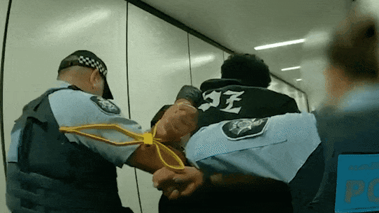 New Zealand man arrested after a flight lands in Melbourne, Australia.