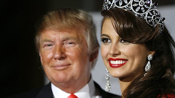 Miss Universe 2009 Stefania Fernandez of Venezuela poses with Miss Universe organization owner Donald Trump.