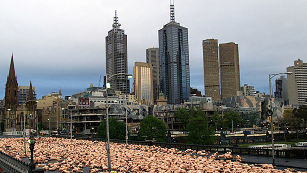 Spencer Tunick photographs a massive landscape of human bodies in Melbourne in 2007.