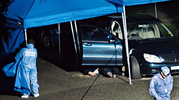 Michael McGurk's body lies beside his car after the murder in Cremorne in September 2009.