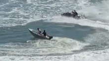 The boat eventually capsized after the jetskis rapidly appraoched it.