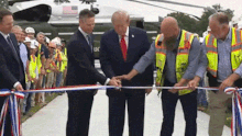 US President Donald Trump was drowned out by the noise from helicopters when he showed off his new White House helipad.