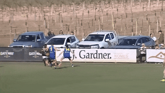 Anthony McDonald-Tipungwuti kicks a goal for Imperials.