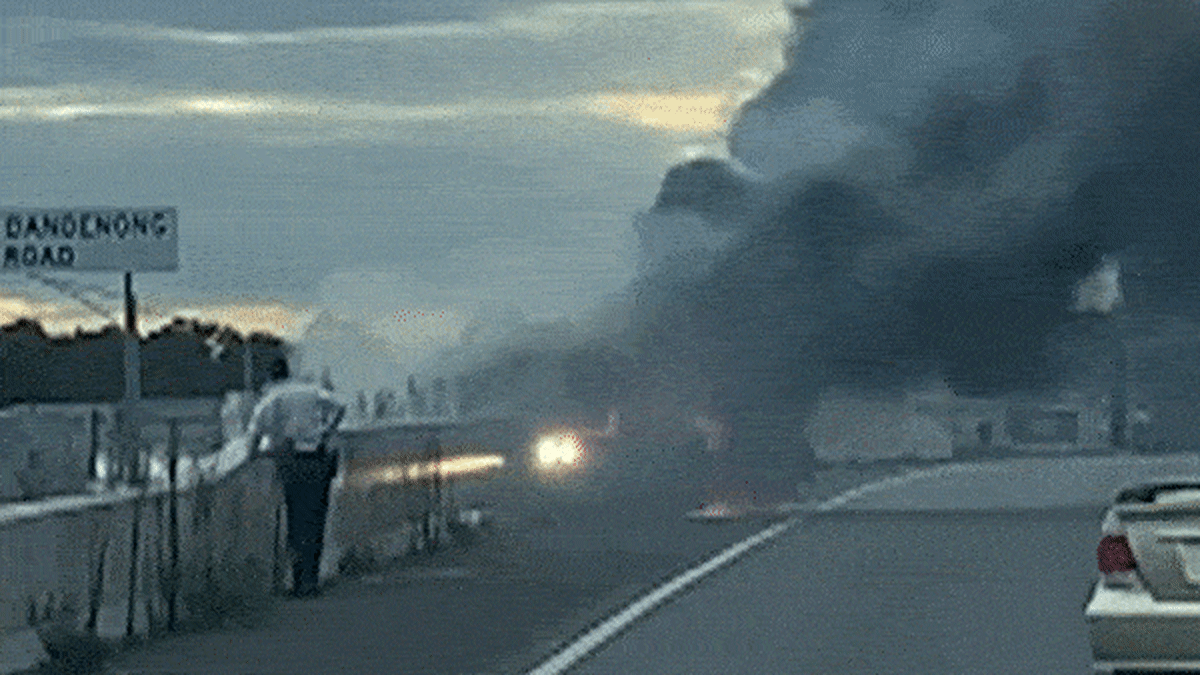 Mornington Peninsula Freeway: Teens jump freeway barriers as stolen car bursts into flames