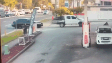 A video shows a black sedan smashing into a petrol station in Padstow, Sydney.