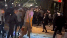 Wembanyama walks into his hotel in NYC.