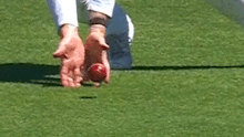 Cameron Green was given not out after the third umpire determined this catch had not carried to slip.