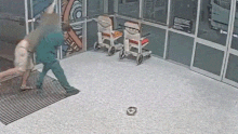 Brisbane nurse Daniel Nelson fights off an assault from a patient at a hospital.