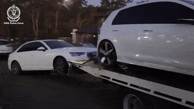 Stolen cars with cloned number plates were seized from a house in Rouse Hill, police allege. 