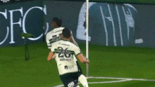 Coritiba defender Jacy Maranhao falls into a hole while celebrating a goal