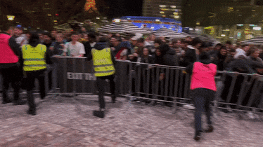 Crowds surge through barricades at Federation Square prior to the Matildas semi-final match against England.