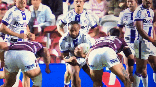 Haumole Olakau’atu and Josh Aloiai flatten Melbourne’s Justin Olam.