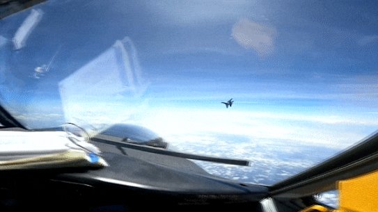 Chinese jet flies across path of US spy plane.