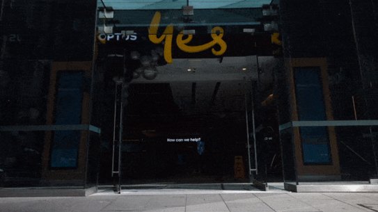 Optus store with people walking past.