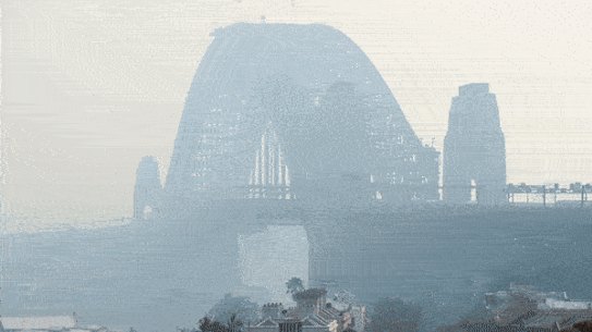 Sydney Harbour Bridge, shrouded by bushfire smoke last November; day turns to a blood red sky in Mallacoota on January 4; Greg Mullins.