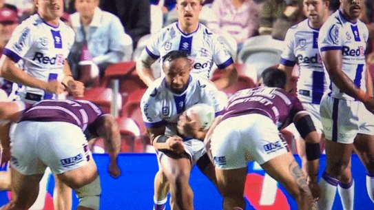 Cop that ... Haumole Olakau’atu and Josh Aloiai flatten Melbourne’s Justin Olam.