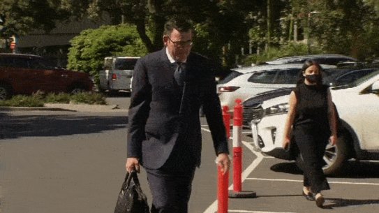 Mr Andrews walking without a mask. 