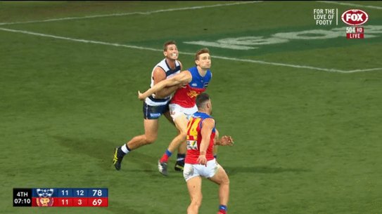 Tom Hawkins was not penalised despite the Lions players appealing for a push in the back.