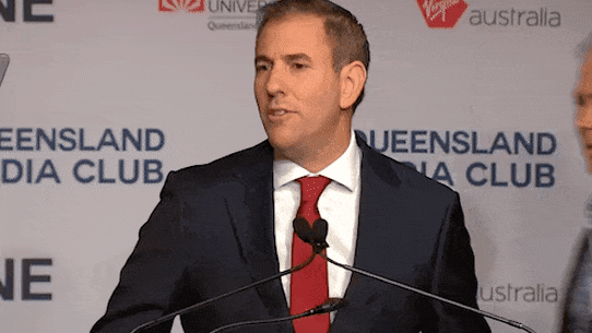 A climate protestor confronts Treasurer Jim Chalmers in mid-March, 2025.