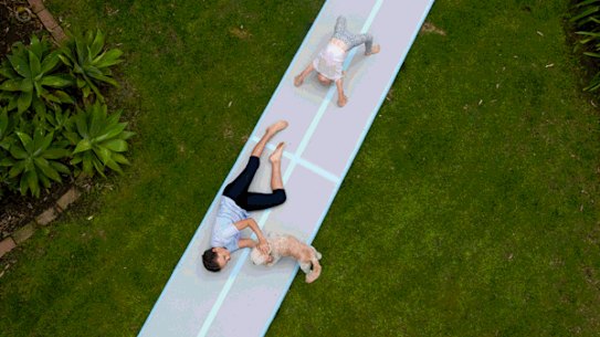 GIF - Ella and Scarlett Chappell playing on their new inflatable gymnastics mat, a lockdown present they will be utilising in the school holidays during Sydney’s Covid-19 restrictions. 16th September 2021 Photo: Janie Barrett
Rachel Chappell and her family on Berowra Waters for school holiday lockdown storyPicture: Rachel Chappell via Andrew Taylor
Rachel Chappell with her daughters Ella (on swing) and Scarlett playing in their backyard on their new tyre swing, something they will be utilising in the school holidays during Sydney’s Covid-19 restrictions. 16th September 2021 Photo: Janie Barrett

Ella and Scarlett Chappell playing on their new inflatable gymnastics mat, a lockdown present they will be utilising in the school holidays during Sydney’s Covid-19 restrictions. 16th September 2021 Photo: Janie Barrett
