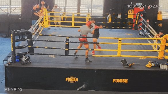 Boxer Justis Huni hits the canvas during sparring in January.