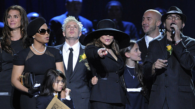 Janet Jackson, left, Prince Michael Jackson II, La Toya Jackson, centre, and Paris Jackson sing during the memorial service for Michael Jackson in 2009.