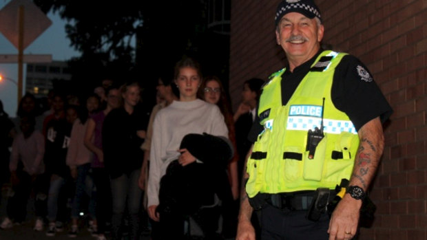Teens are led through Northbridge and the Perth CBD by police officers to teach them how to keep safe. 