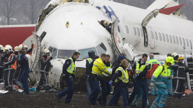 Resue workers attending to the remains of the Turkish Airlines Boeing 737 passenger jet in 2009.