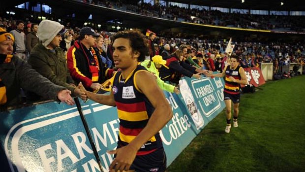 Tony Armstrong celebrates a win with the Adelaide Crows.