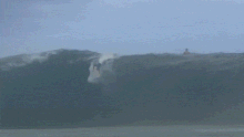 Slater overcame the huge swell to beat Gabriel Medina. 
