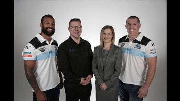 Graeme Holm, second from left, with wife Rebecca and Cronulla Sharks players Jayson Bukuya and Paul Gallen. 