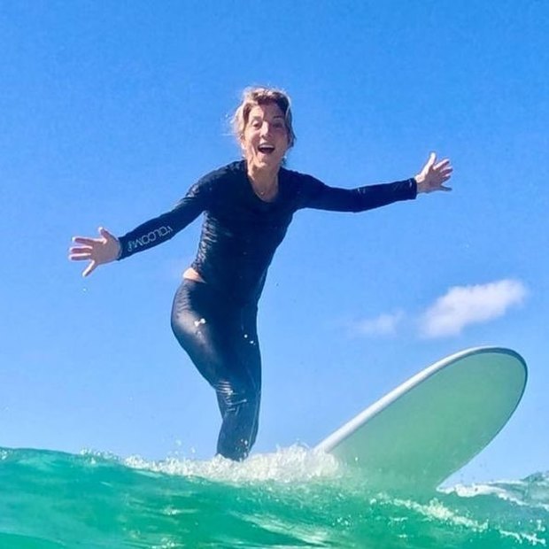 United States Ambassador to Australia Caroline Kennedy gets a surf lesson from Australian three-time world champion surfer Mick Fanning at Kirra Beach in Queensland.