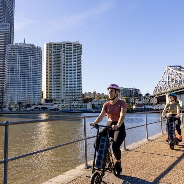 Cyclists by the river at Kangaroo Point.