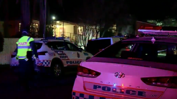 Police outside the Rockhampton home on Tuesday night.